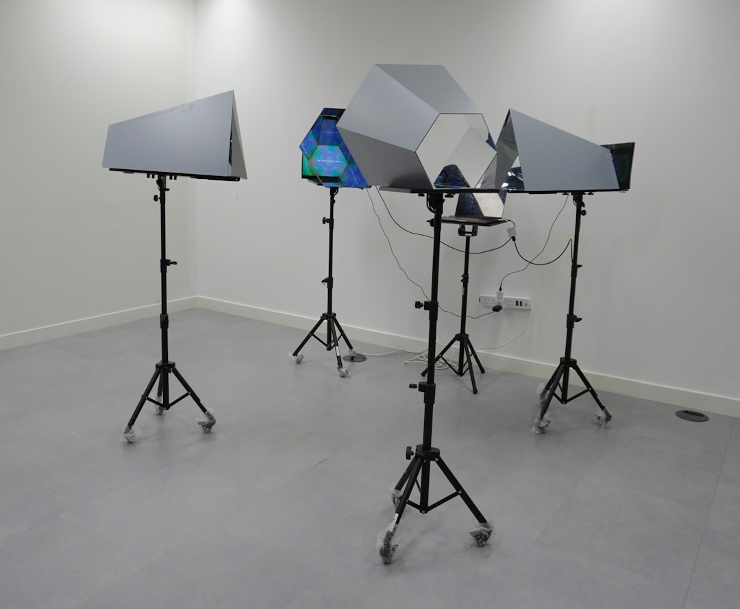 Television studio cameras positioned on a set with lighting rigs